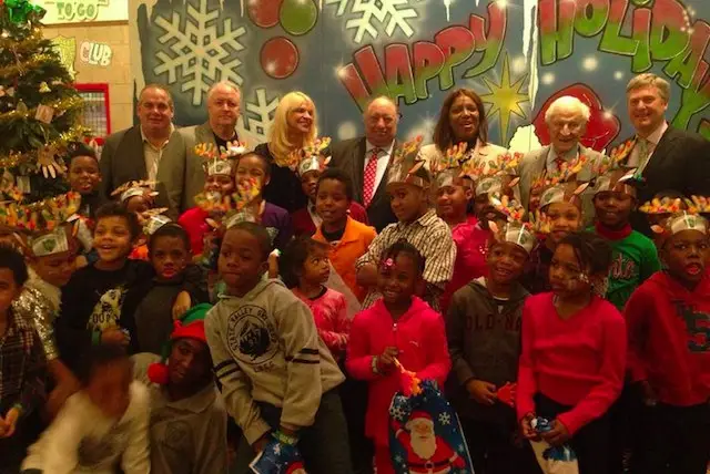 John Catsimatidis, Letitia James, former Manhattan DA Robert Morgenthau, and other guests pose at yesterday's PAL Christmas party